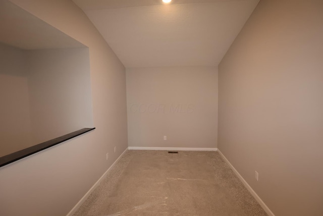 interior space featuring carpet and baseboards