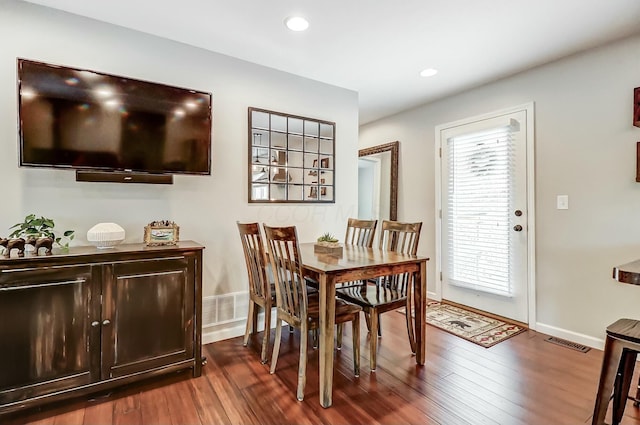 dining room with dark hardwood / wood-style floors