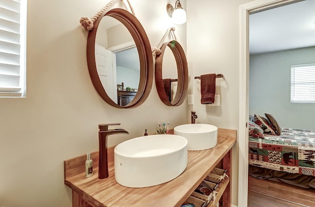 bathroom featuring hardwood / wood-style floors and vanity