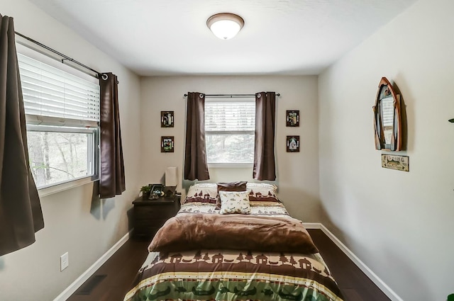 bedroom featuring dark wood-type flooring