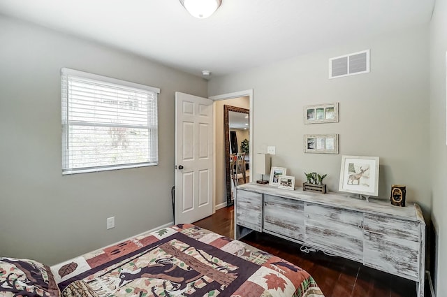 bedroom featuring dark hardwood / wood-style floors