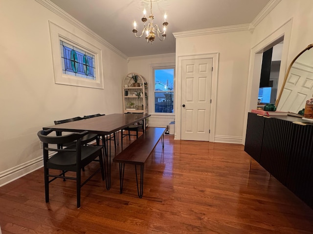 dining space featuring ornamental molding, dark hardwood / wood-style floors, and a notable chandelier