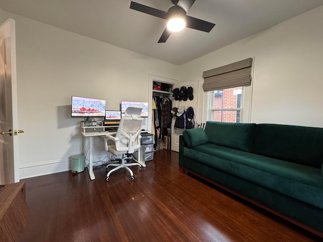 home office with hardwood / wood-style flooring and ceiling fan