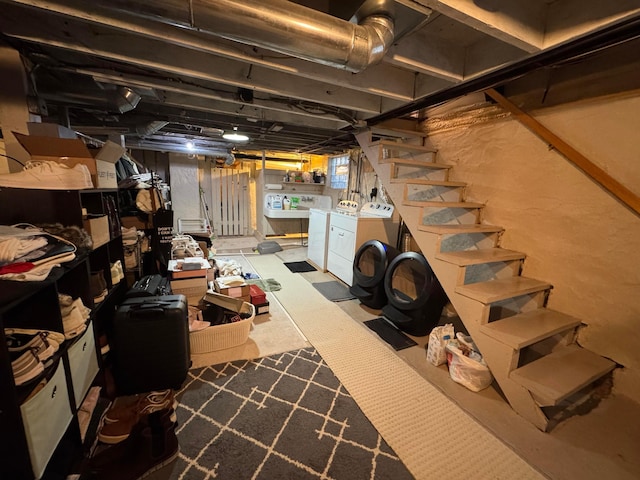 basement with washing machine and clothes dryer