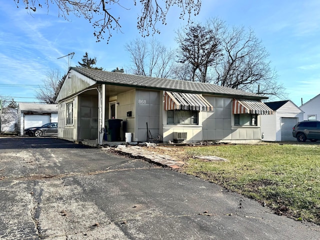 view of property exterior featuring a lawn