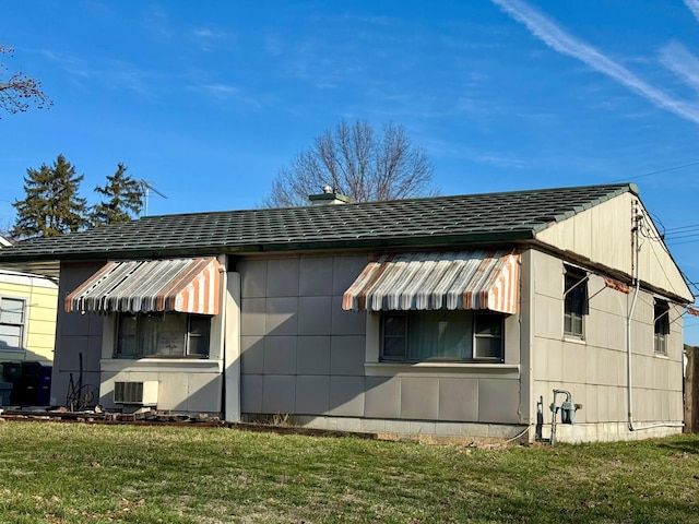 view of property exterior featuring a yard and central air condition unit