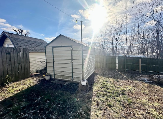 205 2nd St, Russells Point, OH 43348 - view of shed with a fenced backyard
