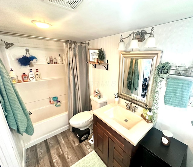205 2nd St, Russells Point, OH 43348 - bathroom with wood finished floors, vanity, and shower / tub combo with curtain
