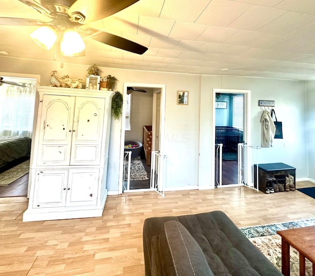 bedroom with ceiling fan and light wood-type flooring