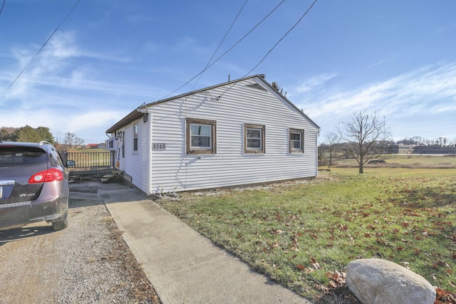 view of home's exterior featuring a yard