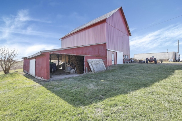 view of outbuilding with a lawn