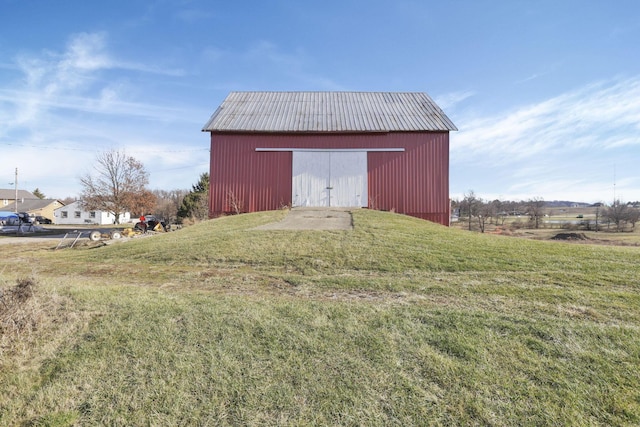 view of outbuilding with a lawn