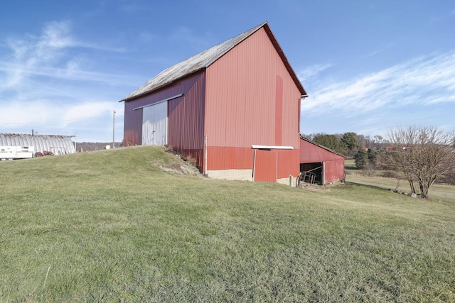 view of outdoor structure with a lawn