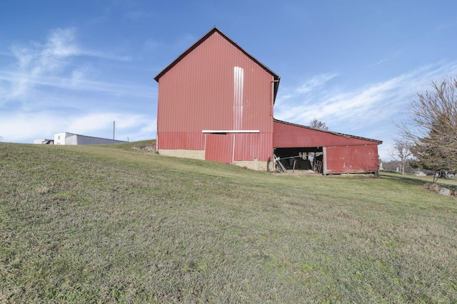 view of outbuilding with a lawn