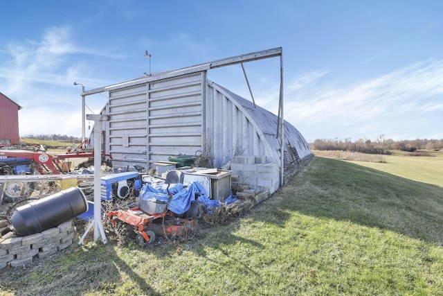 view of outbuilding with a lawn