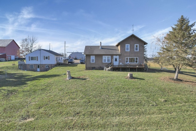 back of house with a yard