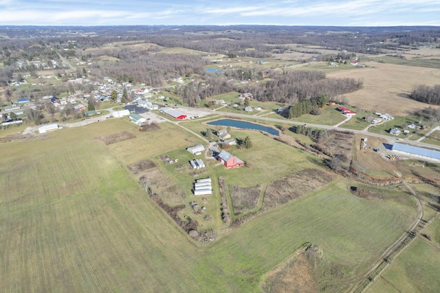 drone / aerial view featuring a rural view and a water view