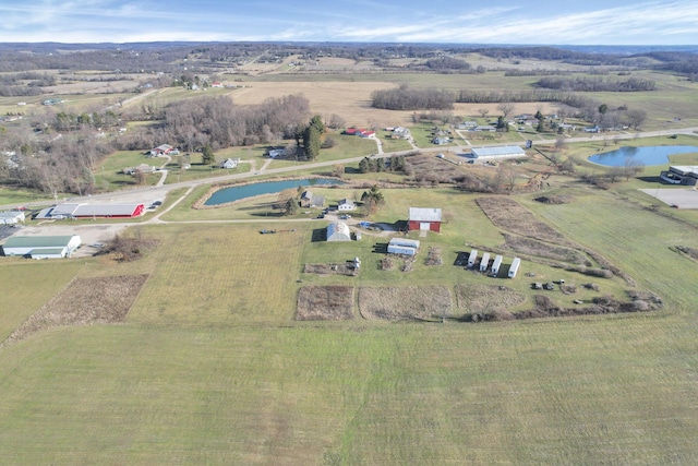 drone / aerial view featuring a rural view and a water view