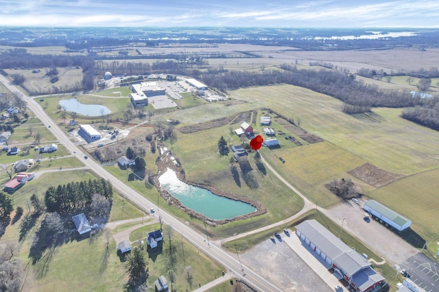 aerial view with a rural view and a water view