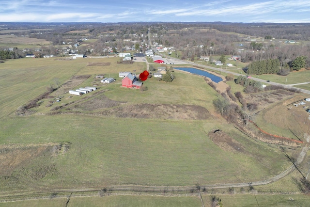 birds eye view of property with a rural view