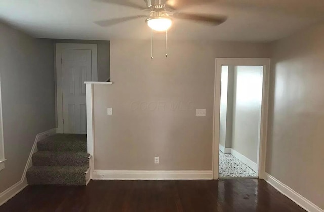 unfurnished room with ceiling fan and dark hardwood / wood-style floors