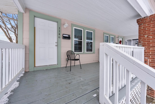 wooden terrace with a porch