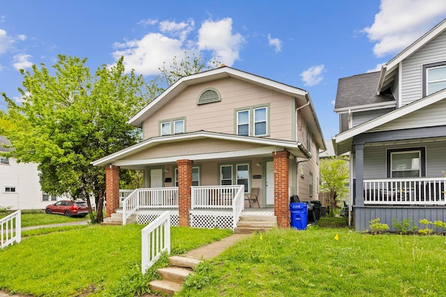1146 S Champion Ave Unit 1148, Columbus, OH 43206 - view of front of property featuring covered porch and a front lawn