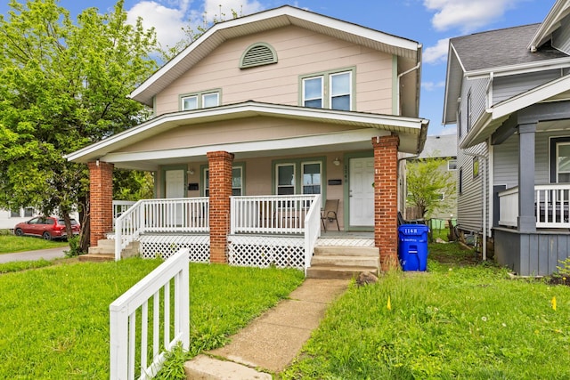 1146 S Champion Ave Unit 1148, Columbus, OH 43206 - view of front of house with a porch and a front lawn