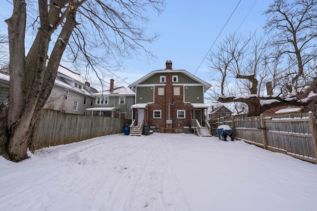 view of snow covered house