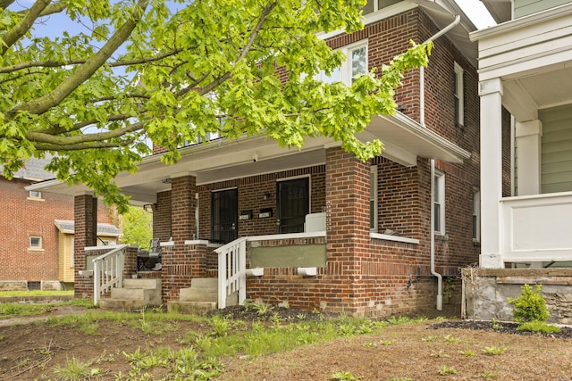 1060-1062 Linwood Ave, Columbus, OH 43206 - view of front of property with brick siding and a porch