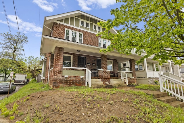 1060-1062 Linwood Ave, Columbus, OH 43206 - townhome / multi-family property with brick siding and a porch
