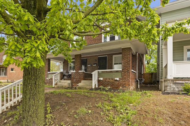 1060-1062 Linwood Ave, Columbus, OH 43206 - view of front of home featuring brick siding and a porch