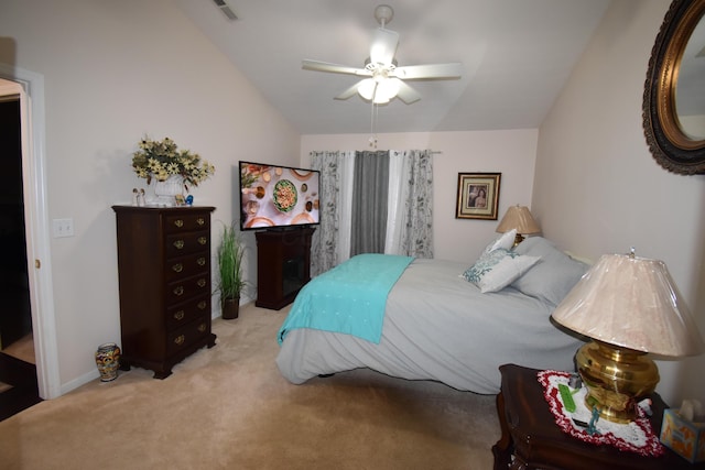 bedroom featuring light carpet, vaulted ceiling, and ceiling fan