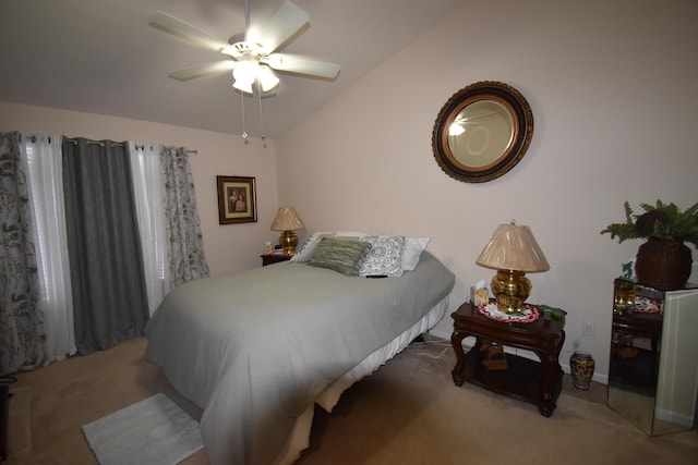 carpeted bedroom with lofted ceiling and ceiling fan