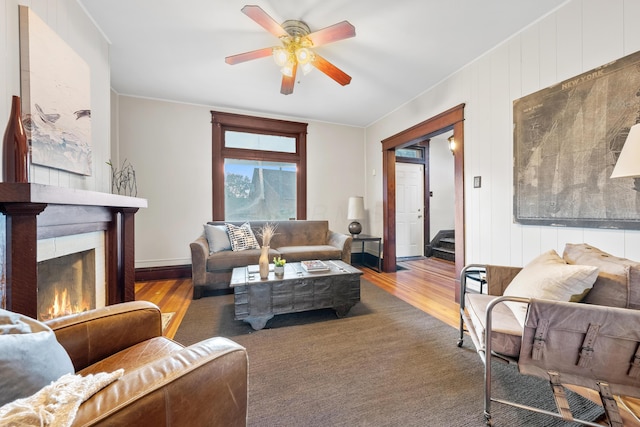 living room with hardwood / wood-style floors and ceiling fan