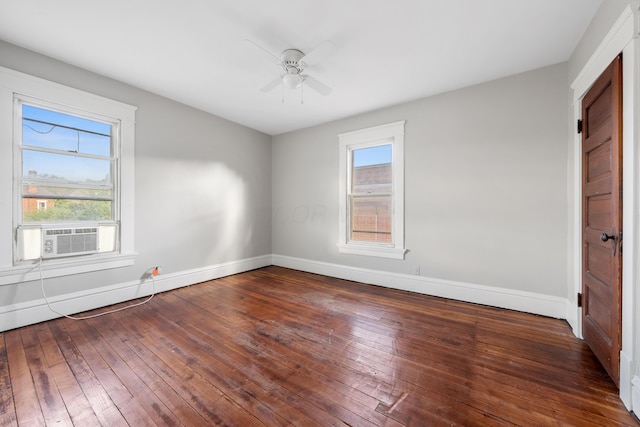 unfurnished room featuring cooling unit, ceiling fan, wood-type flooring, and a healthy amount of sunlight