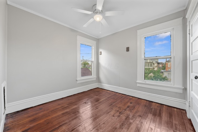 unfurnished room featuring ornamental molding, ceiling fan, and dark hardwood / wood-style flooring