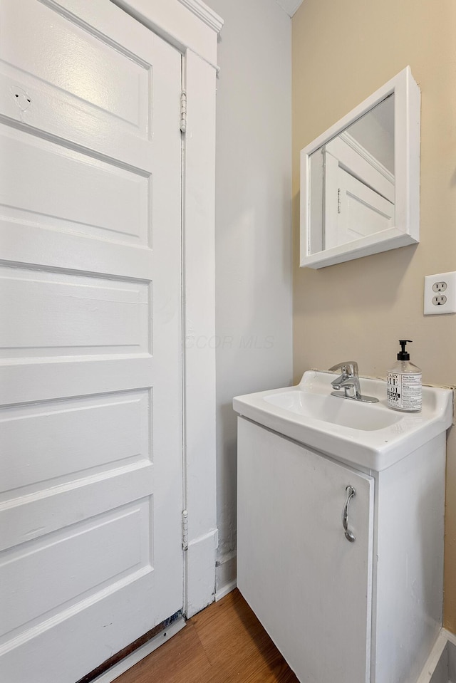 bathroom with sink and wood-type flooring