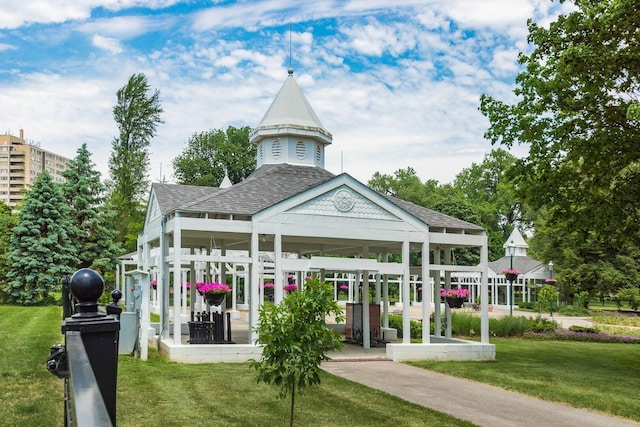 view of property's community with a yard