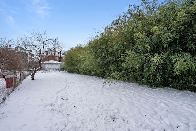 view of yard layered in snow