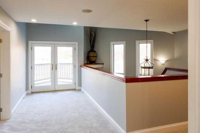 hall with recessed lighting, french doors, baseboards, and carpet floors