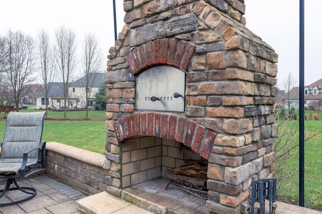 exterior details with an outdoor stone fireplace