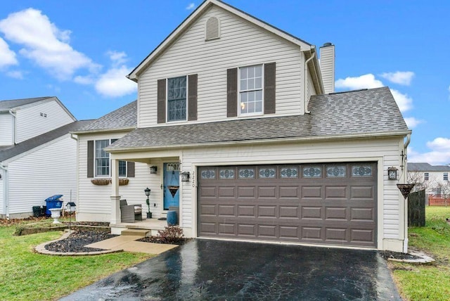 front of property featuring a garage