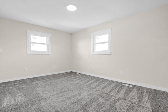 spare room featuring carpet