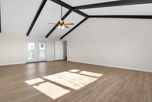 unfurnished living room featuring beam ceiling, ceiling fan, french doors, and light hardwood / wood-style floors