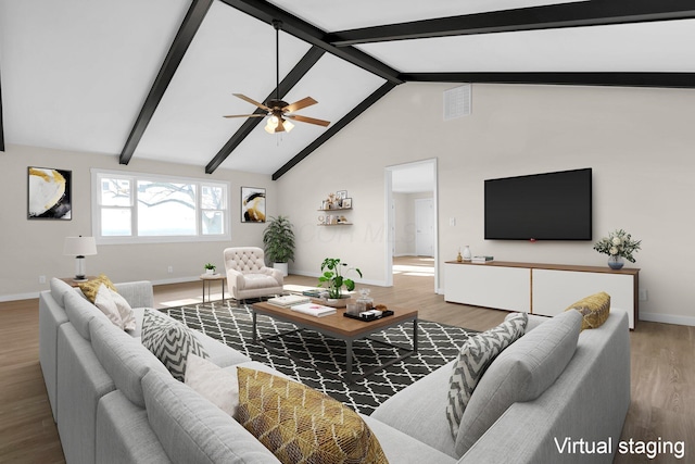 living room with ceiling fan, high vaulted ceiling, beam ceiling, and hardwood / wood-style floors