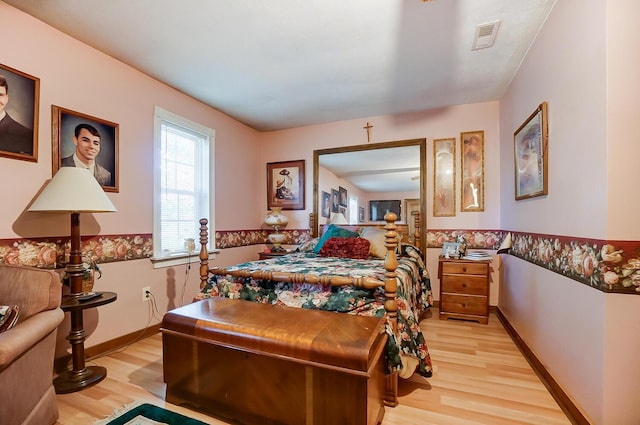 bedroom with light wood-type flooring