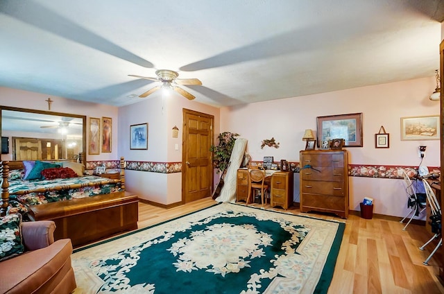 bedroom featuring light hardwood / wood-style flooring and ceiling fan