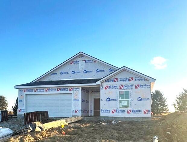 unfinished property featuring a garage