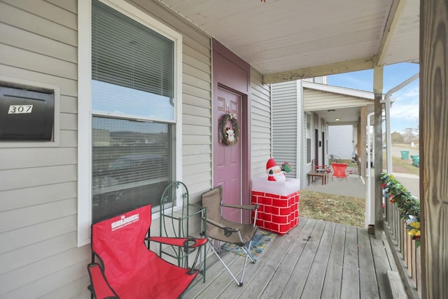 deck with covered porch